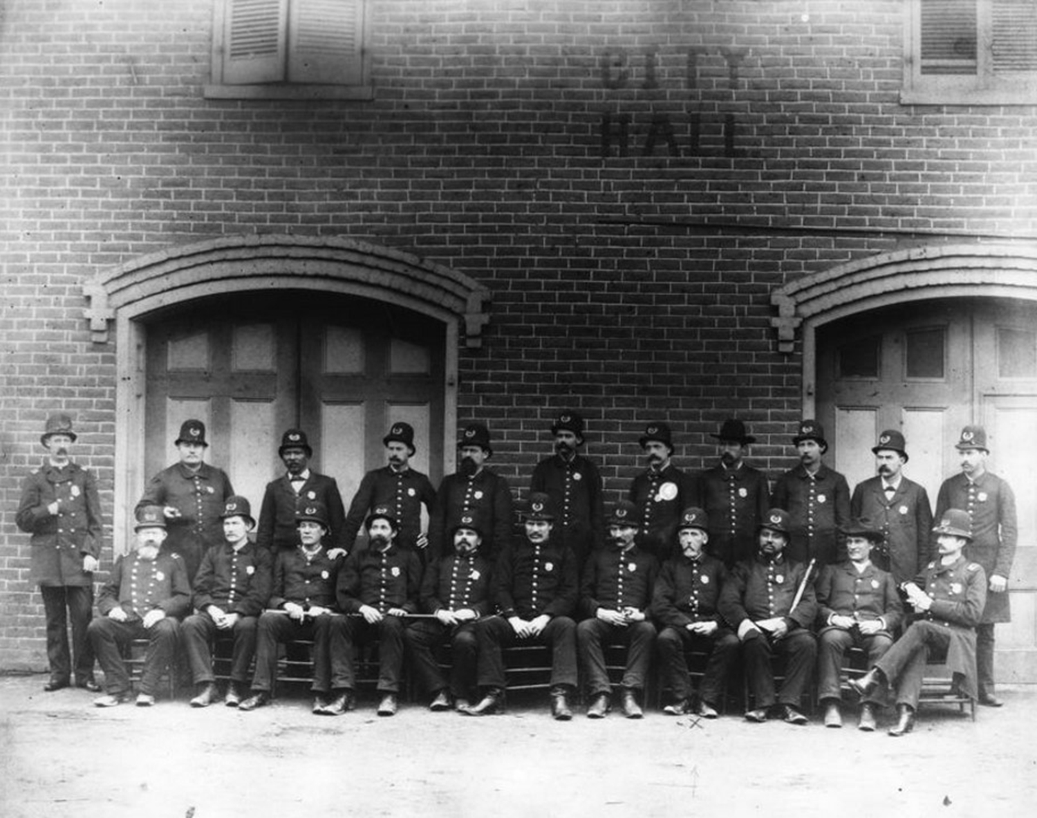 Knoxville Policemen, circa 1877, including two African American officers: James Mason is third from left (standing) and was known to be a former slave. The other officer, third from right (seated) is unknown. (McClung Historical Collection)