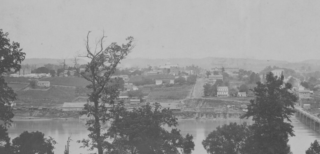 View of the downtown wharves during the Civil War; the old jail is on the far left. (McClung Historical Collection.)